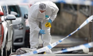 A forensics police officer at the scene of the shooting.
