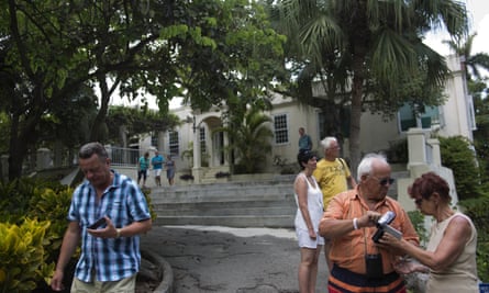 Tourists walk around the home that once belonged to Hemingway, known as Finca Vigía, in Havana.