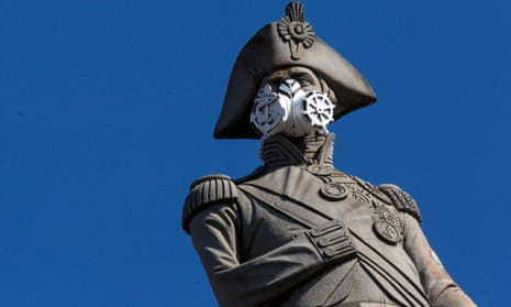 A face mask is placed on the statue of Nelson’s Column by Greenpeace protesters in London. Londoners living in the city’s most deprived areas were on average more exposed to poor air quality than those in more affluent areas.