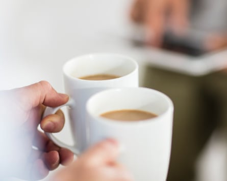 Closeup of person holding coffee cups