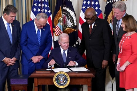 Biden signing a document