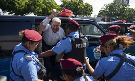 Police agents detain demonstrators participating in the ‘United for the Freedom’ march, in Managua.