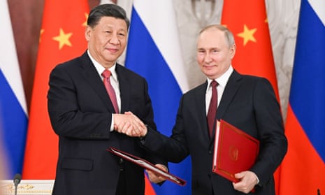 Xi Jinping with Vladimir Putin on his visit to Moscow last month