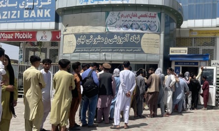 People queuing to withdraw money from a bank in Kabul on Sunday.