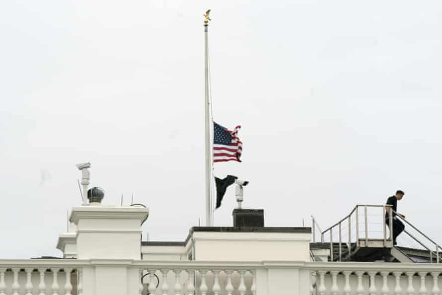 The flag flies at half-staff at the White House on Tuesday.