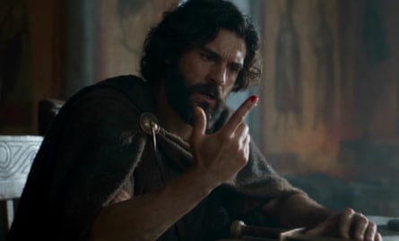 A bearded man, resembling Odysseus, stares at his finger in an AI generated image from Elon Musk’s Odyssey