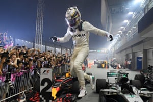 Hamilton celebrates winning the Singapore Grand Prix.