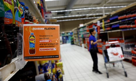 A sign in a French Carrefour store reads: ‘Shrinkflation. This product has seen its litreage decrease and the price charged by our supplier increase.’