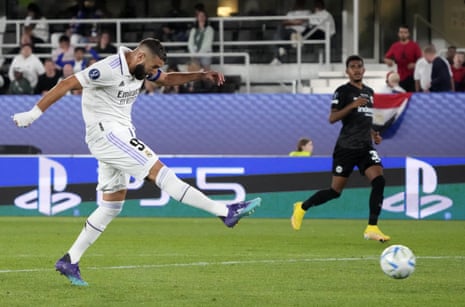 Real Madrid’s Karim Benzema shoots wide of the upright.