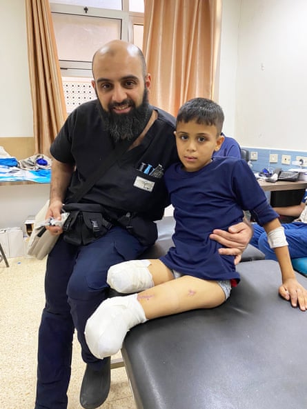 Albeiruti with a young patient who had both of his legs amputated
