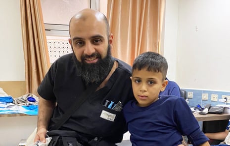 Dr Modher Albeiruti with one of his patients who had both of his legs amputated