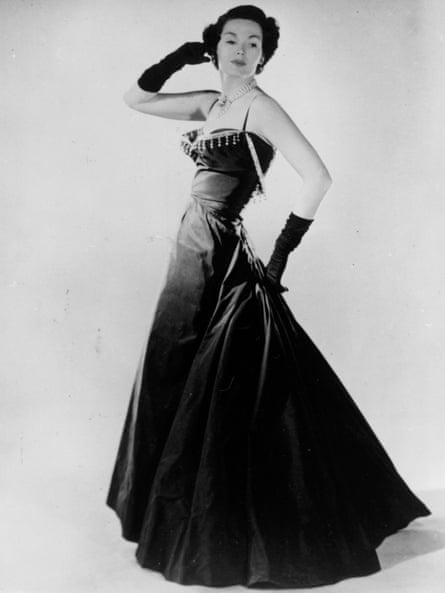 Barbara Goalen models an evening dress by Dior in 1947.