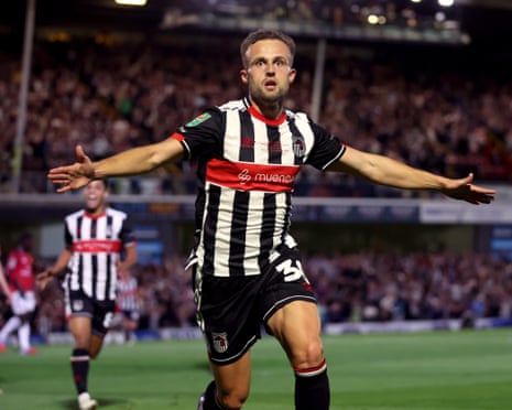Charles Vernam celebrates after putting Grimsby in front against Manchester United.