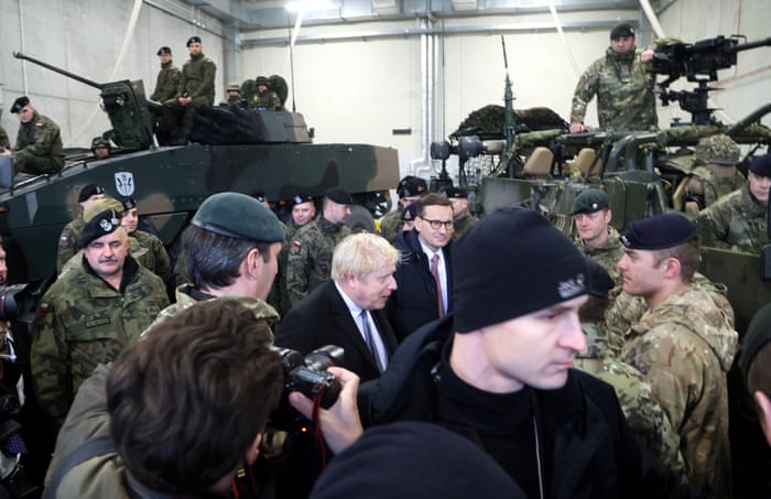 Boris Johnson with his Polish counterpart, Mateusz Morawiecki, meeting with British military engineers stationed in Poland today.