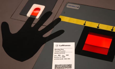 A biometric terminal with fingerprint scanner, left, and boarding card scanner, right
