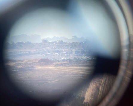 Piles of rubble seen in the distance through the telescope