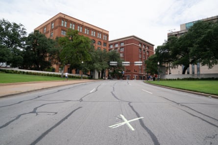 An X marks the spot on Elm Street where President John F Kennedy was shot by Lee Harvey Oswald.