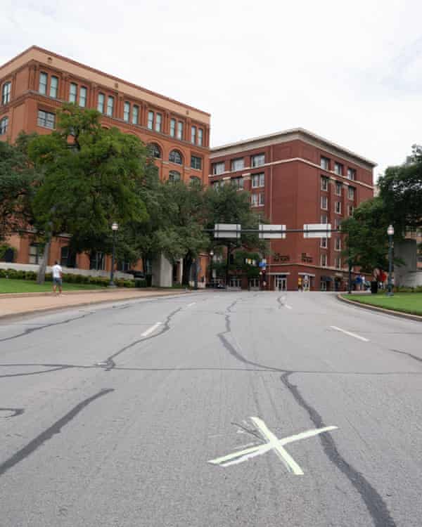 The site on Elm Street, Dallas, where President John F Kennedy was shot from the Texas School Book Depository, left.
