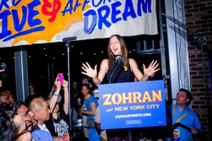 A woman speaks into a microphone