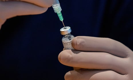 A healthcare worker prepares a dose of the Pfizer/BioNTech coronavirus disease (COVID-19) vaccine