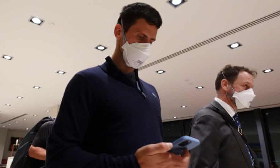 Novak Djokovic in Melbourne airport before boarding a flight after losing his appeal.