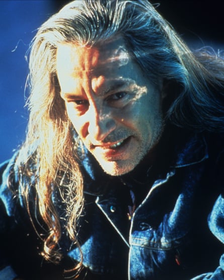 Frank Silva with long blond hair and wearing denim jacket as Killer BOB