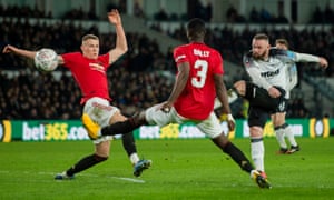 Wayne Rooney sends a second-half shot over the bar.