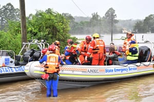 Upper Colo, Australia: A family of four is evacuated from a flooded property.