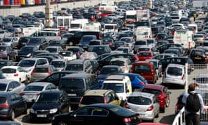 Cars wait at a departure point at the car ferry terminal in Calais, France.