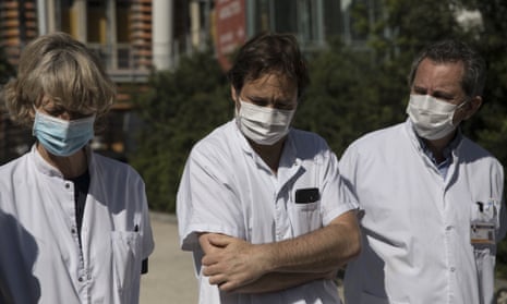Medical staff speaking outside La Timone hospital in Marseille after a boy died of Kawasaki disease.
