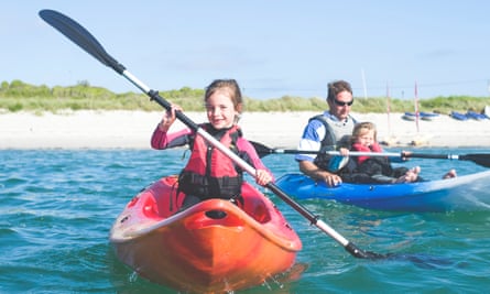 Family kayaking off the Isles of Scilly