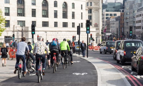 Cyclists on segregated cycle lane in London