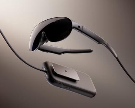 The Meta VR Glasses and tethered compute puck on a dark background.