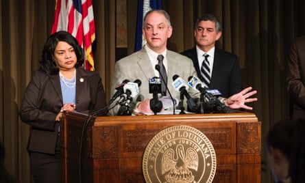 Governor John Bel Edwards (center) making his budget announcement,
