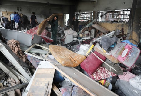 Palestinians inspect the damage at a school sheltering displaced people, following an Israeli strike, in Jabalia refugee camp, in the northern Gaza Strip.