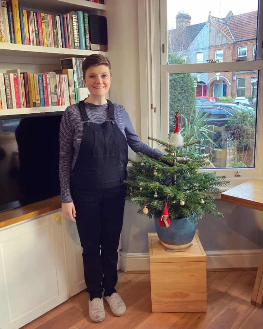 Picture of Kate Green by a Christmas tree.