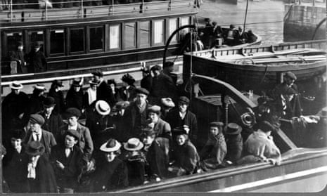A black and white image of Irish emigrants on board a boat