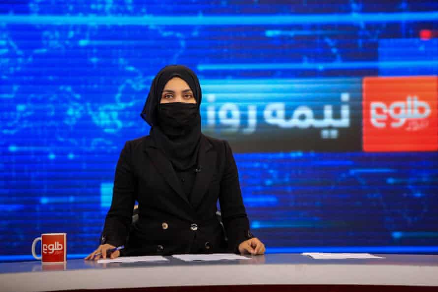 Khatira Ahmadi, an Afghan presenter at Tolo TV reads news wearing a mask, Kabul, Afghanistan, 23 May 2022.