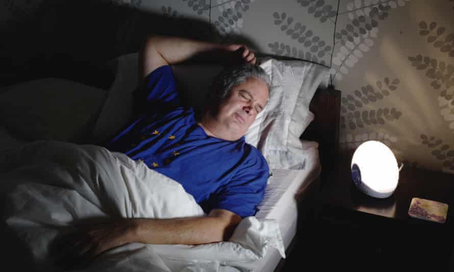 Wakey-wakey ... Stephen Moss with his alarm side light. Photograph: Sarah Lee for the Guardian