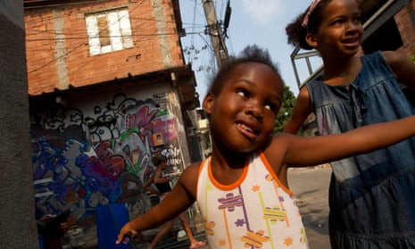 Children play in the favela complex of Mare, where promised improvements include the municipal Schools of Tomorrow project offering children a full-day in school and better facilities.
