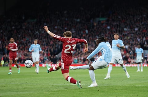 Jérémy Doku scores Manchester City’s second goal against Liverpool.