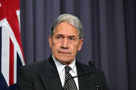 New Zealand’s minister of foreign affairs, Winston Peters, in front of a UK flag.