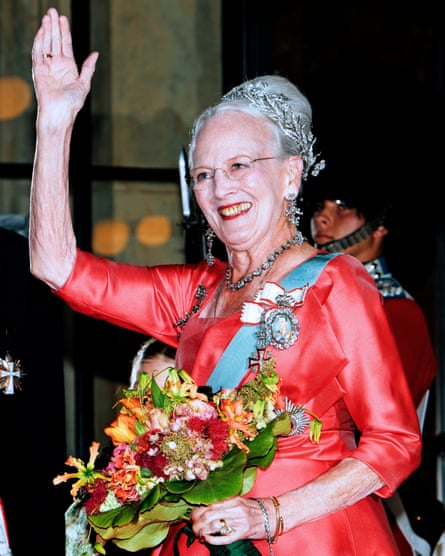 Queen Margrethe dressed up and waving