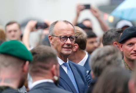 German Chancellor Friedrich Merz (C) attends the inauguration of the German 45th Armoured Brigade 'Lithuania', at the Cathedral Square in Vilnius, Lithuania.