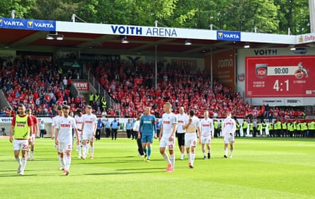 Köln players look dejected after the team’s 4-1 defeat and relegation from the Bundesliga.