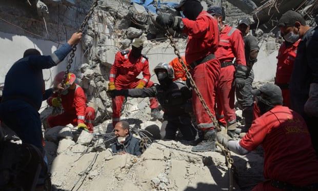 Firefighters look for bodies buried under the rubble, after an air strike against Islamic State triggered a massive explosion in Mosul, Iraq. Photograph: STRINGER/Reuters  