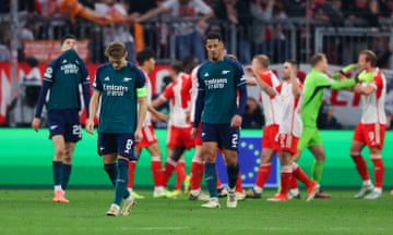 From left: Kai Havertz, Martin Ødegaard and William Saliba cannot hide their despair as Harry Kane (far right) and his Bayern Munich teammates celebrate Champions League progress.