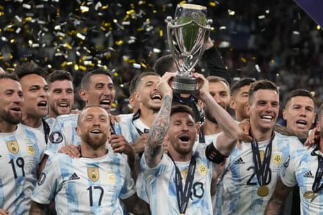 Lionel Messi lifts the trophy after Argentina won their intercontinental match with Italy.