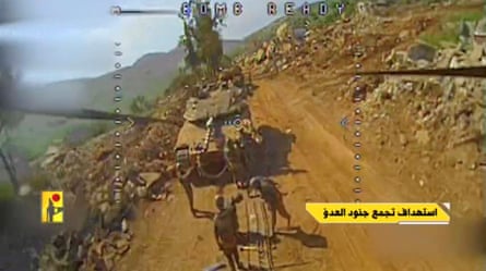 A screengrab from a video released by Hezbollah which says it shows an Israeli tank and soldiers moments before being hit by an FPV drone in Taybeh, Lebanon.