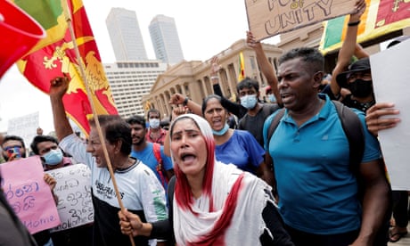 Sri Lankans shout slogans during a protest against Gotabaya Rajapaksa in front of the presidential secretariat building in Colombo